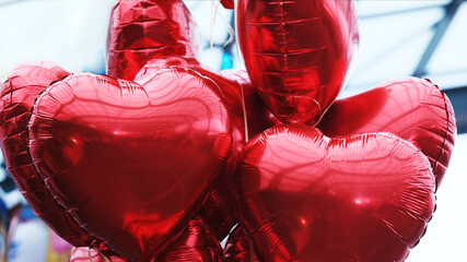 Red Heart-Shaped Balloons Tied Together
