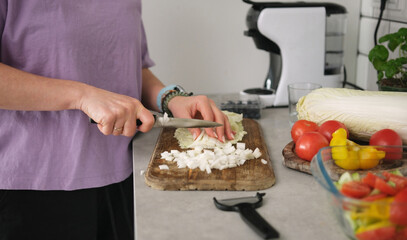 Girl Slicing Chinese Cabbage On Cutting Board