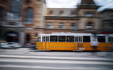 Yellow City Tram Blurred In Motion