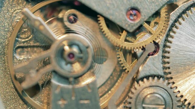 Close-up of vintage clockwork mechanism with interlocking brass gears and metallic components, for mockup or texture overlay