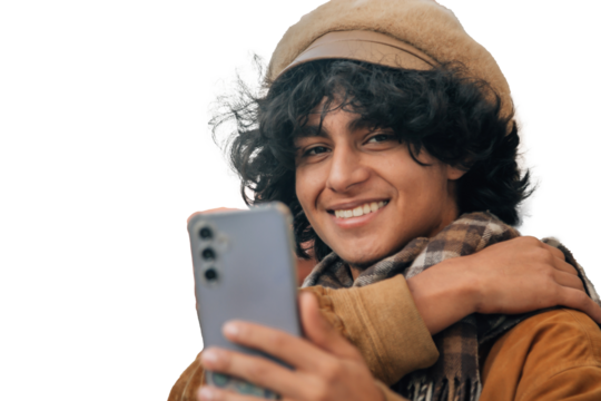 Young man with mobile phone and winter clothes isolated, cut out