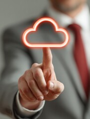 A business professional touches a glowing cloud icon, symbolizing cloud technology and digital solutions.