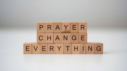 A close-up of stacked wooden blocks arranged neatly on a white table