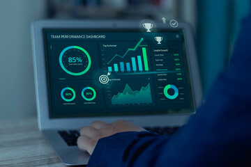 HR specialist monitors a real-time team performance dashboard with key metrics and KPIs. A concept of business intelligence, data analytics, and employee evaluation for growth.