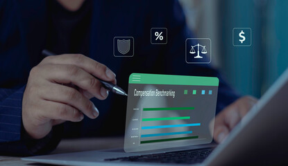 HR professional uses a virtual interface for compensation benchmarking, analyzing salary data against the market rate to ensure fair pay and competitive employee benefits.