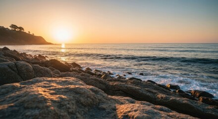 Coastal sunset over rocky shore