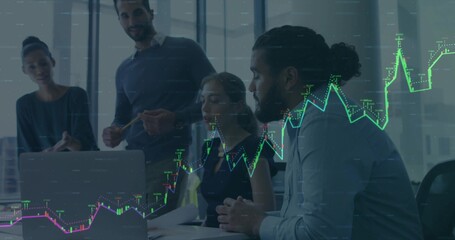 Collaborating business team analyzing financial chart on laptop in glass meeting room, with reports