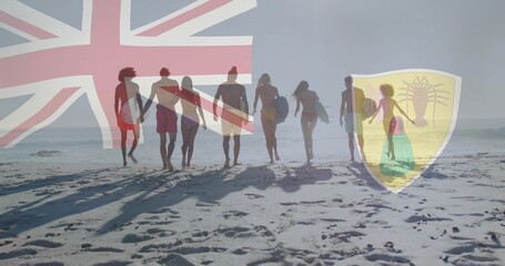 Fototapeta premium Walking eight surfers in swimwear carrying surfboards on beach, with flag overlay and lobster crest