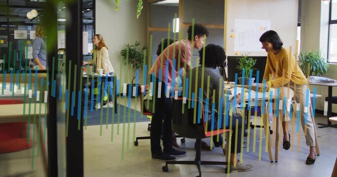 Discussing results five colleagues reviewing bar-chart overlay in open-plan office, with laptops