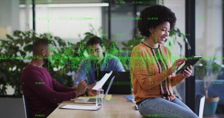 Using tablet, Black female worker consulting data in meeting room, with digital data overlay