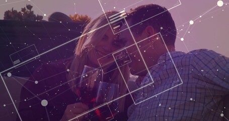 Couple leaning heads holding red wine glasses on rooftop, with succulents under digital overlay