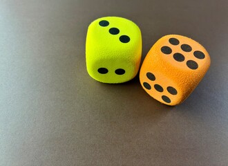 Colorful Dice Pair on Brown Background Representing Luck and Decision Making
