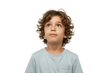 Young boy with curly hair looking up isolated on transparent PNG, child portrait with brown eyes and thoughtful expression for innocence and wonder