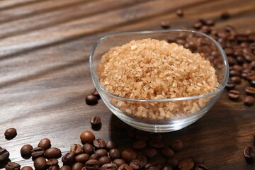 Natural sea salt and coffee beans on wooden table, closeup