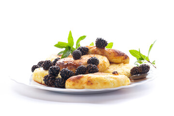 Traditional dairy pancakes with pine cone jam and mint leaves