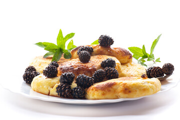 Traditional dairy pancakes with pine cone jam and mint leaves