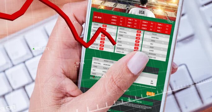 Hand gripping smartphone starting grid chart rising and falling tapping and monitoring betting odds