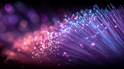 Fiber optic strands emitting points of light to depict high speed data transfer, conveying global connectivity and the concept of modern digital communication networks.
