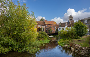 Salisbury, Wiltshire, UK:  The River Avon in central Salisbury seen from Fisherton Street with St Thomas's Church in the background.
