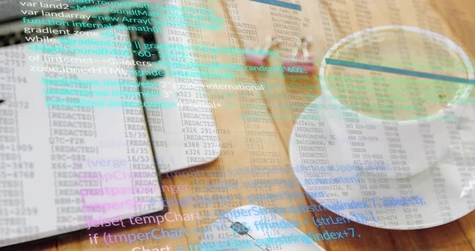Code lines fading in over wooden desk setup while scrolling downward illustrating coding workflow