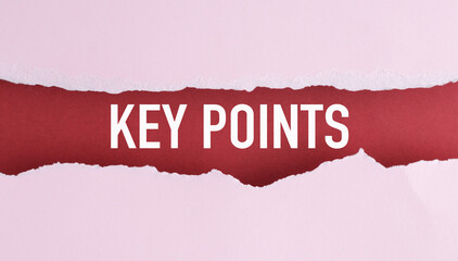 A sign that says Key Point with a paper cutout of a hole in it.