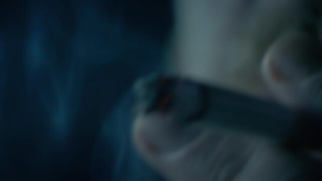 Smoker In Gloomy Dark Area Detail
