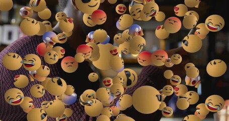 Man scrolling tapping smartphone in cafe, social media emoji cloud emerging dispersing smiling - Powered by Adobe