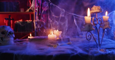 Spooky Halloween Decor with Candles and Skull