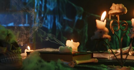 Halloween Scene with Candles and Skull on Creepy Table