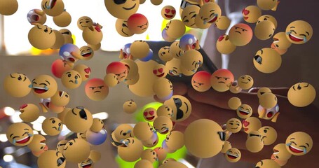 Woman holding smartphone tapping screen, causing emoji cloud multiplying and dispersing for ads - Powered by Adobe