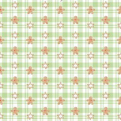 Seamless watercolor pattern with gingerbread cookies in the shape of stars and men on green plaid background. Perfect for Christmas wrapping paper, textile, fabric print, wallpaper, and holiday design