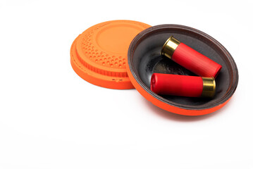 Red shotgun shell and clay pigeon target on white background , Gun shooting game