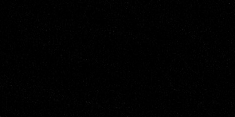 Fototapeta premium Dark paper texture background illuminated by a flash of light, creating a night space design pattern for video