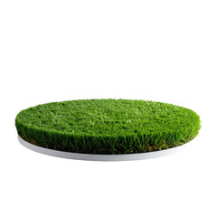 A circular patch of vibrant green grass rests on a white platform against a black background