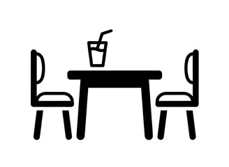 Fototapeta premium Table with two chairs and a drink