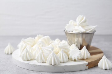 Delicious meringue cookies on grey table, closeup