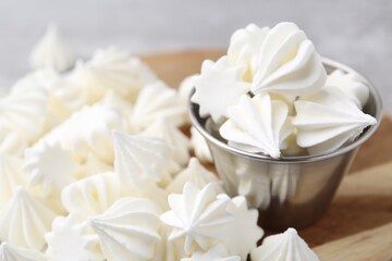 Delicious meringue cookies on table, closeup view