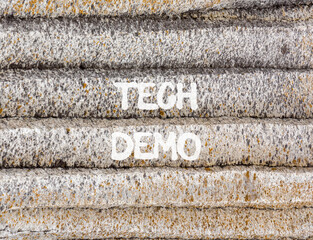 Tech demo symbol. Concept word Tech demo on beautiful grey mountain wall. Beautiful grey mountain wall background. Business tech demo concept. Copy space.