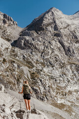 Woman Hiking Alone in Alpine Mountain Landscape