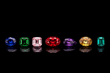 A row of gemstones with different colors and shapes