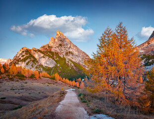 Empty trek to Falzarego pass with Sass de Stria peak on background. Amazing autumn scene Dolomite Alps, Cortina d'Ampezzo lacattion, Italy, Europe. Beauty of nature concept background.
