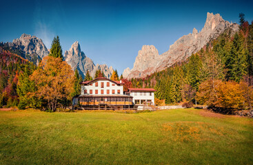 Impressive autumn view of hottel on Pradidali valley, Province of Trento, Italy, Europe. Majestic morning scene of Dolomite Alps. Beauty of countryside concept background.