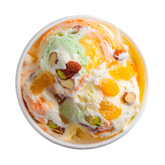 Top view of pistachio and mango ice cream with nuts in a cup. Gourmet Indian Kulfi style frozen dessert isolated on black background.