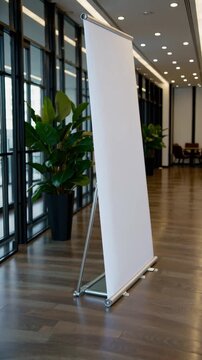 Empty conference room ready for presentation with vertical banner stand and plants