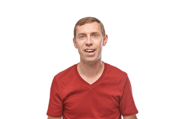 Fototapeta premium Young caucasian male smiling in red t-shirt on white background.