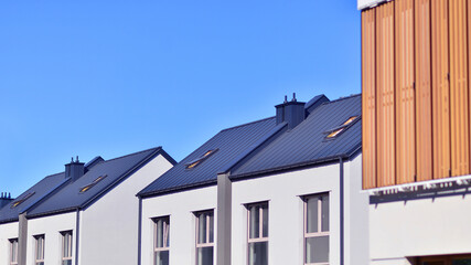 Newly built terraced houses in a residential area. Modern terraced houses on the outskirts of the city.
