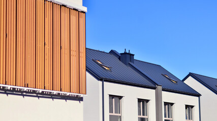 Newly built terraced houses in a residential area. Modern terraced houses on the outskirts of the city.