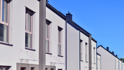 Newly built terraced houses in a residential area. Modern terraced houses on the outskirts of the city.