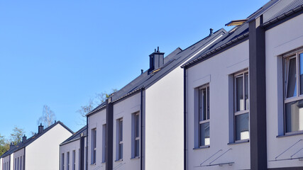 Newly built terraced houses in a residential area. Modern terraced houses on the outskirts of the city.