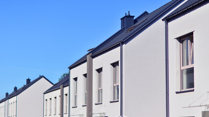 Newly built terraced houses in a residential area. Modern terraced houses on the outskirts of the city.